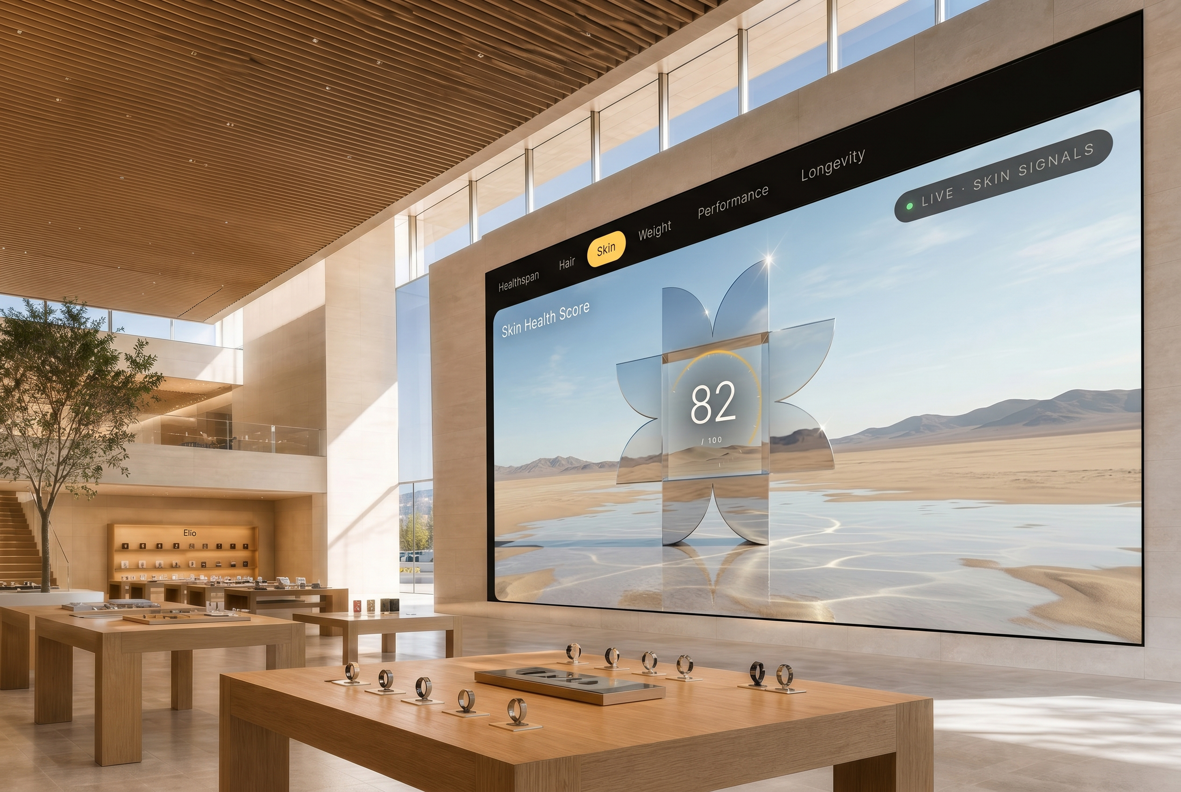 A floor-to-ceiling LED wall inside the Elio concept store showing live Elio Scores, with white oak display tables and wearables in the foreground